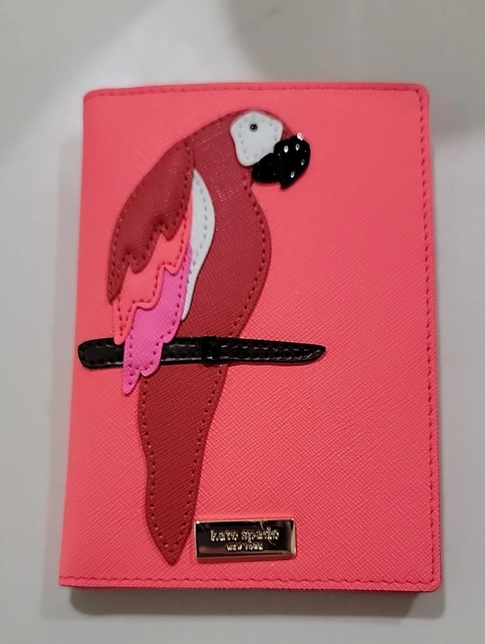 kate spade coral Talk The Talk Imogene Passport Holder Featuring Parrot